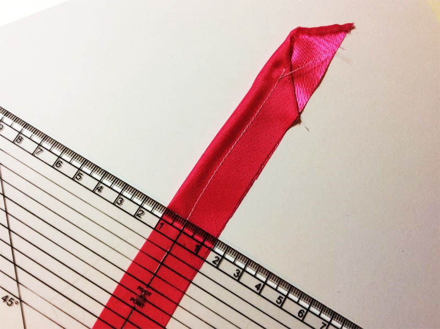 Fold the right sides of your strip together and stitch 6mm in from the fold for a narrow loop